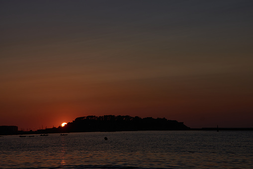 La Ladeira Beach turns red with the sunsets with the background of Monte Real and the Cies Islands