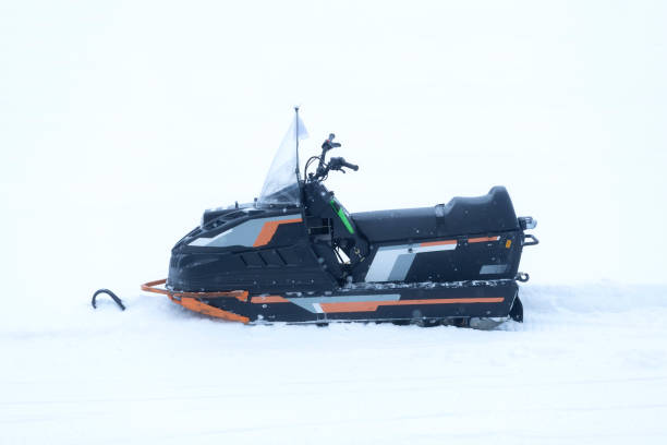 istock A snowmobile on a snowy highway. 1985629992