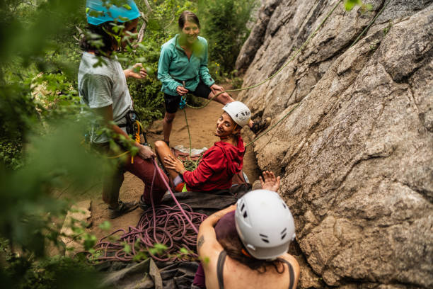istock Climber friends having fun during climbing outdoors 1985634078