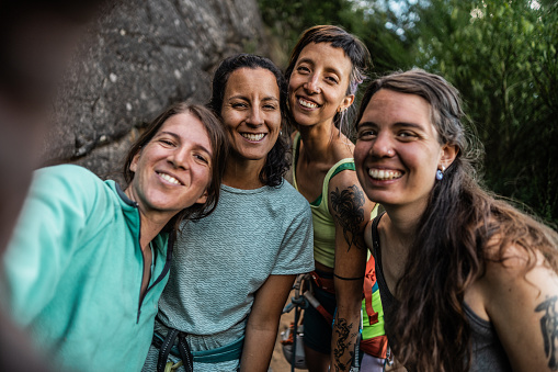 Female climber friends taking a selfie outdoor - camera point of view
