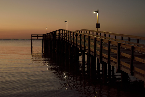 The sun sets on the Bayfront Park municipal pier in Daphne, Alabama, on Feb. 2, 2024.