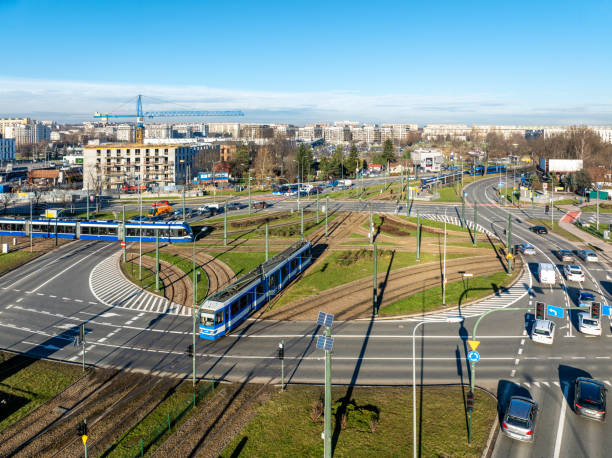 traffic circle with tramways, trams and cars in krakow, poland. aerial view - lesser poland foto e immagini stock