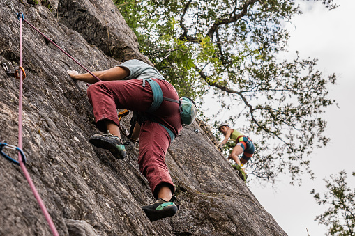 Female climber climbing mountain