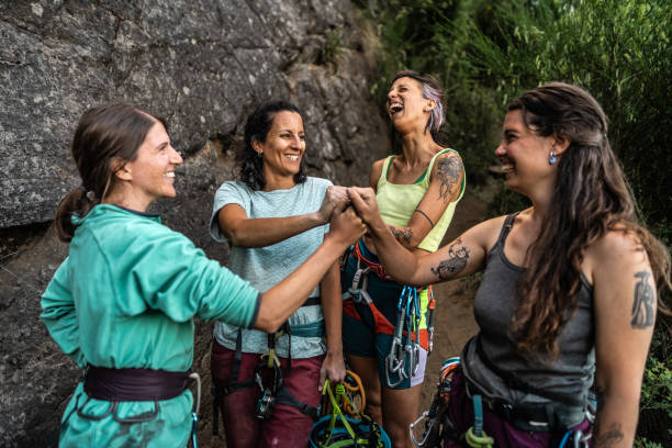 istock Climber friends with stacked hands outdoors 1985661580