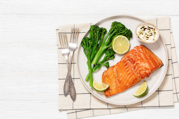 istock hot smoked salmon with cooked broccoli and lime 1985667276