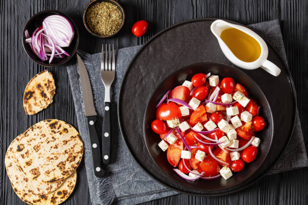 istock tomato salad with red onion and white cheese 1985667623