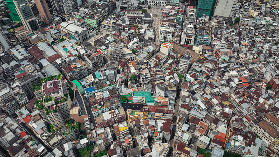 An aerial photograph capturing the expansive view of a city with numerous towering buildings.