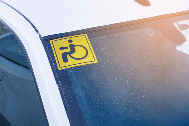 istock A sticker on the windshield of a car warning that the driver is a disabled driver with disabilities. 1985757963