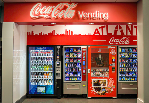 hoto of Coca Cola vending machines in the Hartsfield-Jackson International Airport in Atlanta, Georgia. The soft drink company is headquartered in Atlanta.