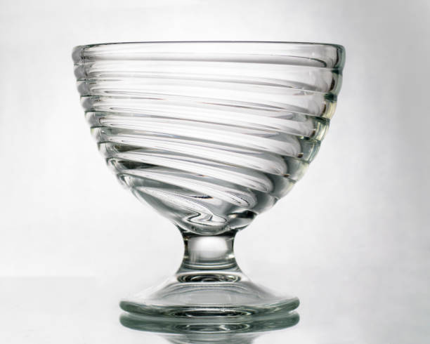 istock One empty glass bowl on a high stem on a white background 1985885316