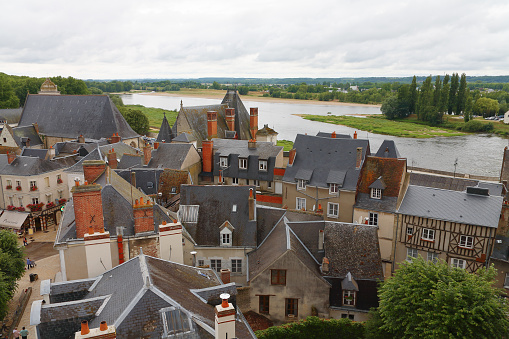 Amboise, France - June 9, 2010: This aerial view of houses and their roofs is a fragment of the architecture and landscape of the Loire Valley seen from the walls of the castle towering over the town.