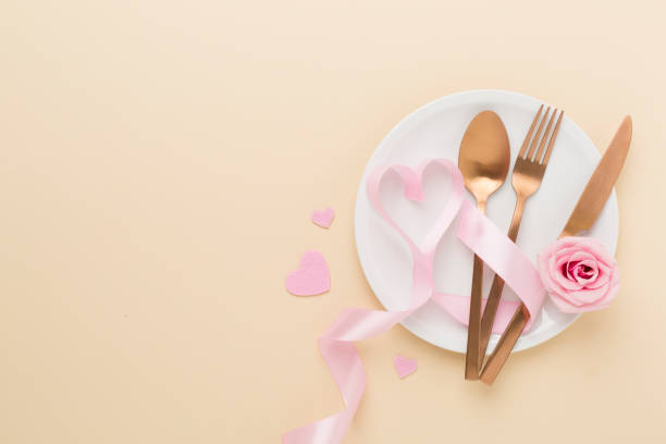 istock Festive table setting for Valentine's Day on color background, top view 1986000209