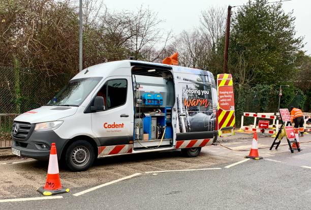 Billericay, UK - January 25, 2024: A Cadent van parked in the road with workmen carrying out gas pipe works in Billericay, Essex, UK.