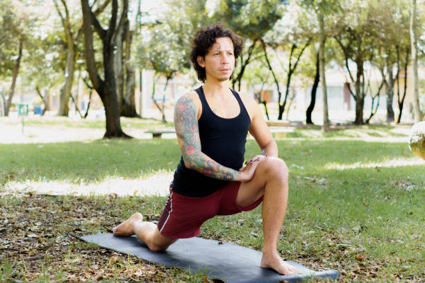 istock a young man with short hair practicing yoga 1986019941