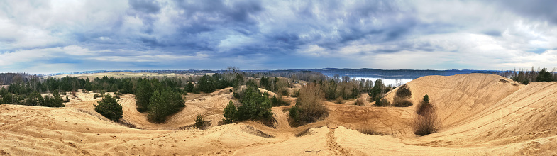 Panoramic view of sand mountains on a cloudy day