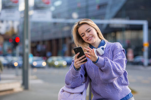 istock City Connection: Young Woman Typing with Joy 1986042989