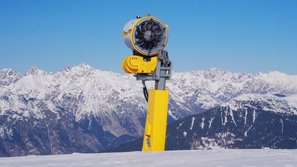 istock Snow Cannon Artificial Snowmaking Machine In Standby Mode at Ski Resort Slope in Austrian Alps Mountains 1986044233