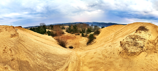 Panoramic view of sand mountains on a cloudy day