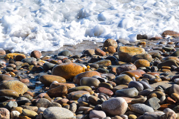 istock Incoming Water at Rock Beach 1986071587