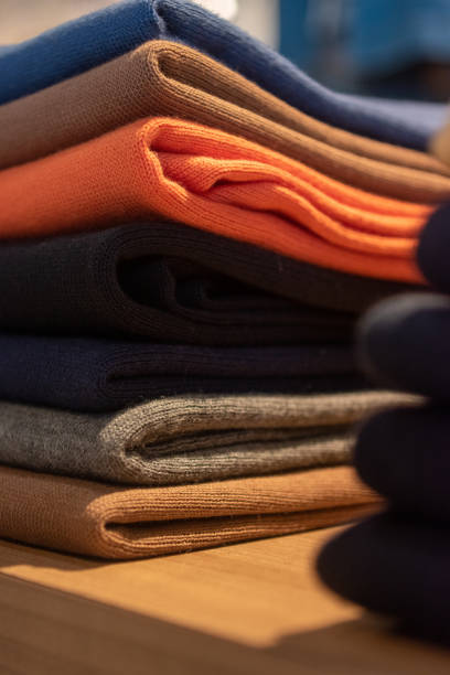 istock Stack of colorful clothes in a boutique. 1986085527