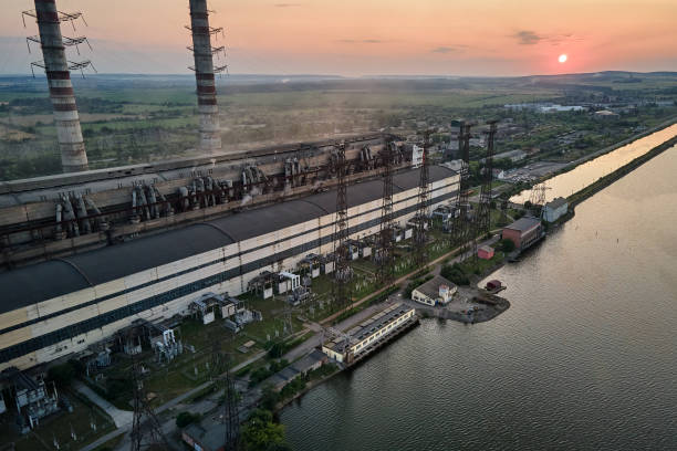 aerial view of coal power plant high pipes with black smokestack polluting atmosphere. electricity production with fossil fuel concept - vapor trail night sky sunset - fotografias e filmes do acervo