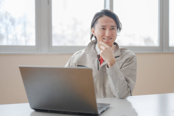 Young man with dwarfism working from home