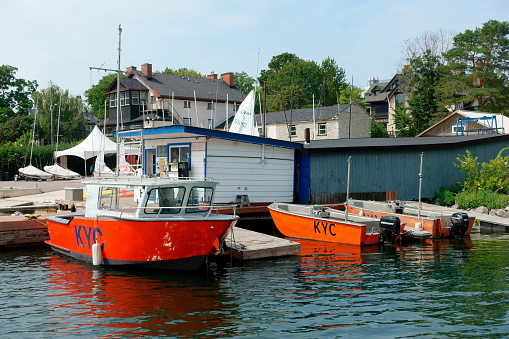 Canada, Kingston - August 22, 2023: Orang boats moored in Kingston yacht club marina, located on the Lake Ontario