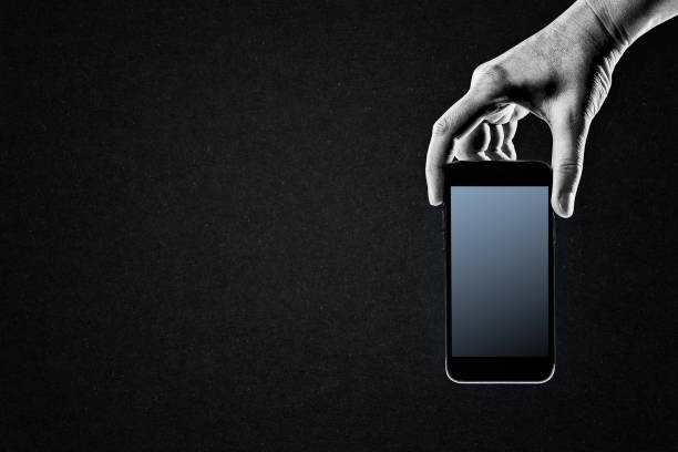 istock Hand Holding Mobile Phone 1986122118