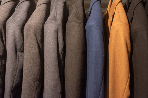 istock suits on hangers in a clothing store 1986122631