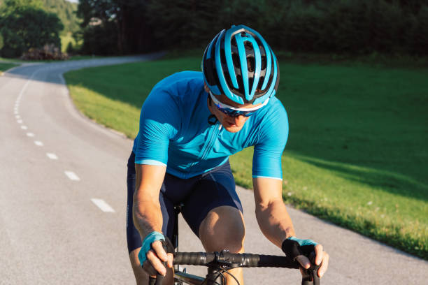 istock Man racing cyclist in a sprint cycling pose 1986146344
