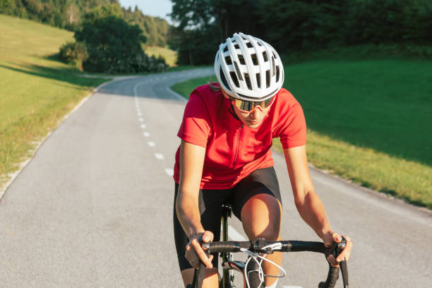 istock Female bicyclist changing a body position during a race, front view 1986165316