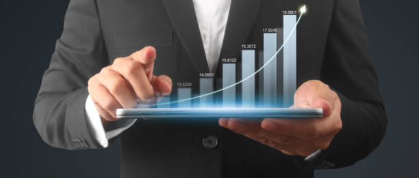istock Businessman plan graph growth and increase of chart positive indicators,tablet in hand 1986187210