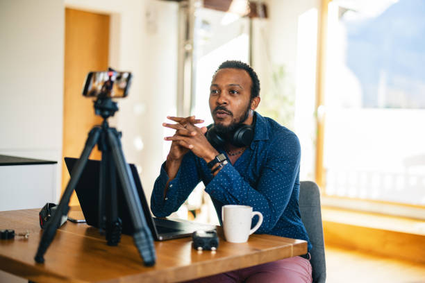 istock Content Creator Recording a Video at Home Office 1986194494