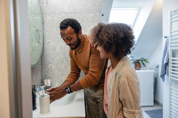 istock Father and Daughter Having Fun During Morning Routine 1986198696