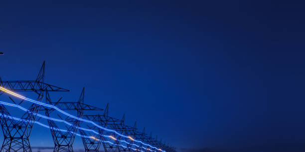 istock High voltage electric transmission tower with glowing current line 1986221473