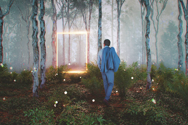 istock Businessman walking in forest with mysterious portal 1986249664