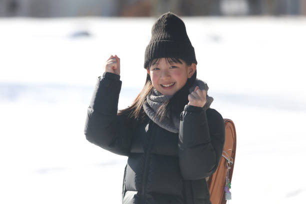 istock Smiling girl carrying a school bag 1986282816