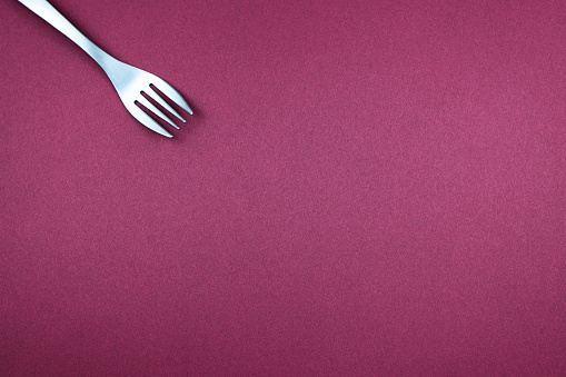 Fork on a red background