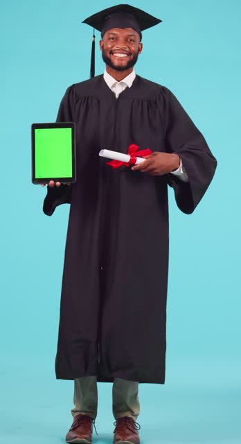 Education, graduation and green screen on a tablet with a student black man in studio on a blue background. Portrait, certificate and chromakey on a mobile display with a male college graduate