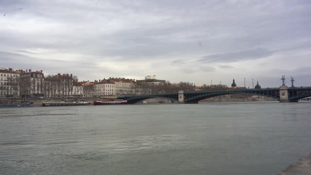 Rhone River Flowing Through Lyon's Classic Buildings, Connected by Iron Bridges, Offering a Beautiful Panoramic View of France