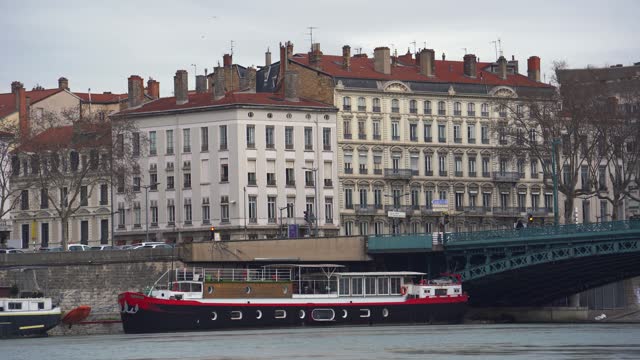 Lyon's Charms: Classic Architecture, Iron Bridge, and Cruise Ship Along the Rhone River, Inviting a Scenic Tour Through the City's Waterways
