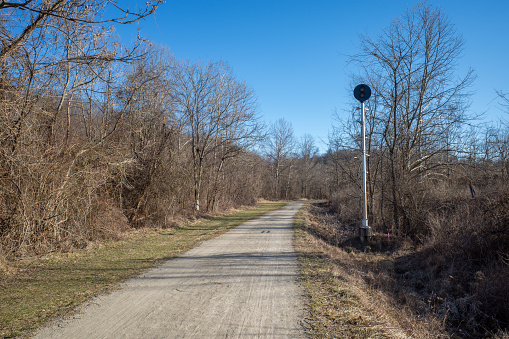 A forsaken traffic signal stands silent along the Youghiogheny River Trail in Westmoreland County, adjacent to the long-shuttered Banning Mine number four.