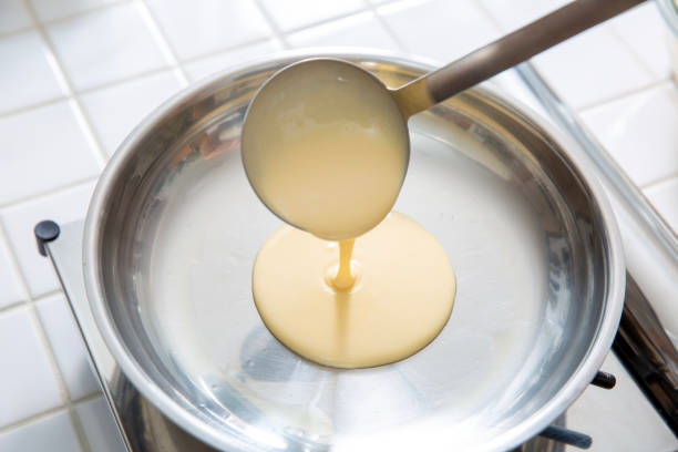 istock Making pancakes, close-up of cooking scene 1986487864