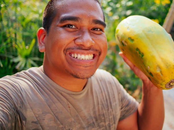 happy man carry papaya