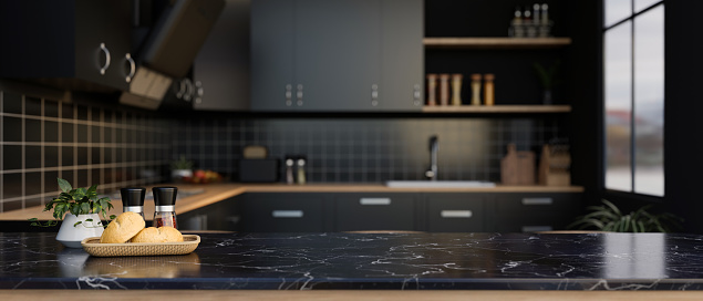 A space for displaying your product on a luxury black marble kitchen countertop in a modern black kitchen with kitchen appliances. 3d render, 3d illustration