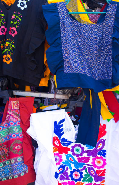 oaxaca, mexico: colorful embroidered blouses at market - mexico dress market clothing imagens e fotografias de stock