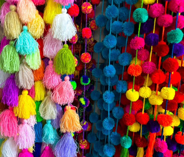 istock Oaxaca, Mexico: Strings of Pompoms at Market Full Frame 1986552929