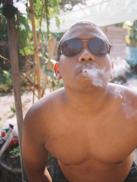 south asian brown man smoking