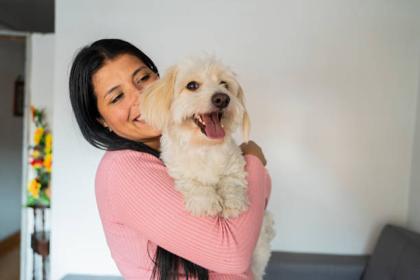istock woman hugging her dog 1986581622