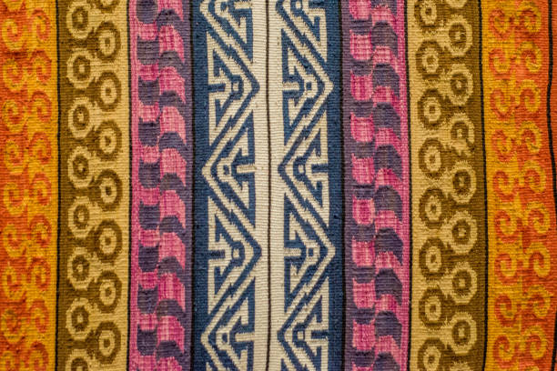 istock pre-Hispanic serape with embroidery in the form of multicolored fretwork that forms an original and very Mexican pattern 1986588535